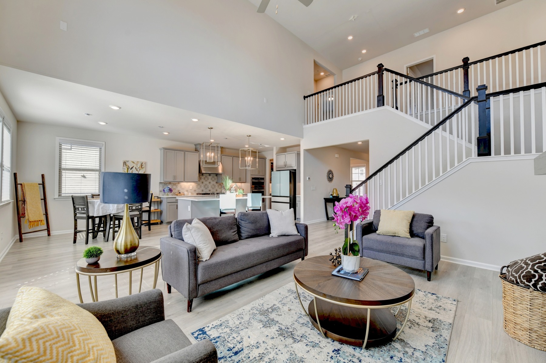 Two-story family room with fireplace and open connection to the kitchen